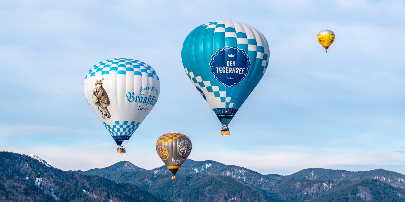 Hei&szlig;luftballone von der Urlaubsregion Der Tegernsee bei der Montgolfiade